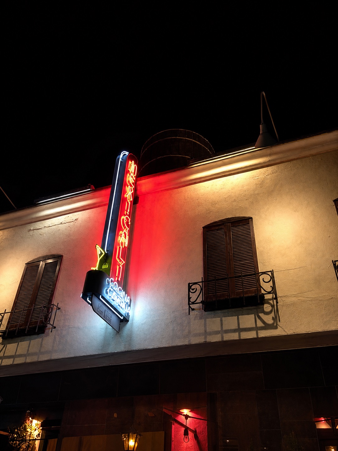 The Mexicali Cocina and Cantina facade glowing at night on Ventura Boulevard
